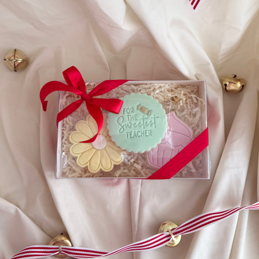 Hand-decorated cookies designed for teacher appreciation, featuring school-themed shapes and personalized details.”